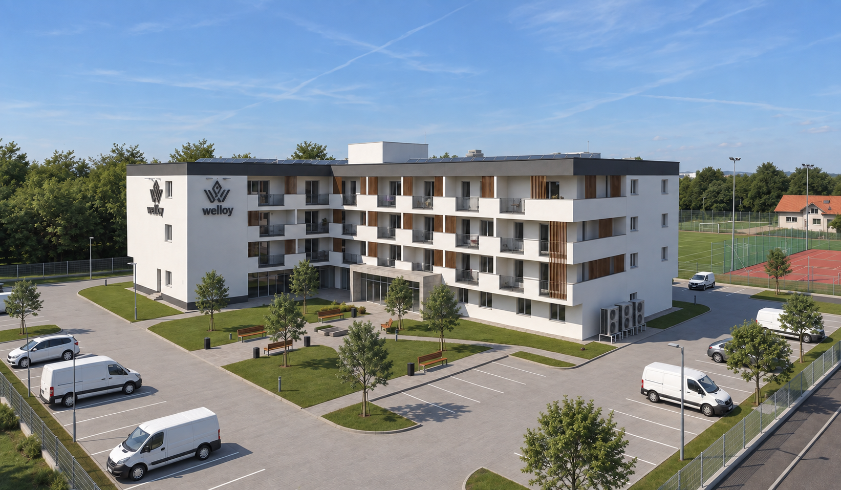 Miskolci munkásszálló-épület a környező parkosítással